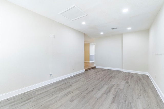 2121 23rd St SW, Largo, FL 33774 - unfurnished room with recessed lighting, light wood-type flooring, baseboards, and attic access