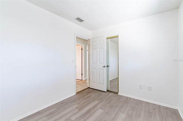 2121 23rd St SW, Largo, FL 33774 - unfurnished room featuring light wood-style floors and baseboards