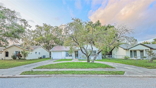 7033 Wentworth Way, New Port Richey, FL 34655 - ranch-style home featuring curved driveway, an attached garage, and a residential view