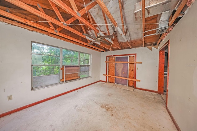 7033 Wentworth Way, New Port Richey, FL 34655 - empty room featuring concrete flooring, baseboards, and a ceiling fan