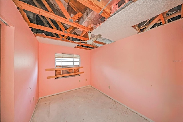 7033 Wentworth Way, New Port Richey, FL 34655 - unfurnished room with concrete flooring and baseboards