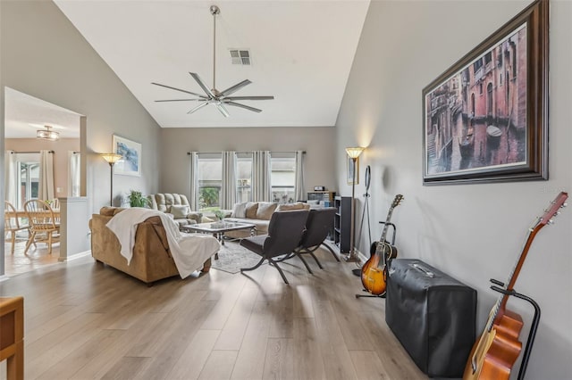 9322 Via Segovia, New Port Richey, FL 34655 - living area featuring high vaulted ceiling, a ceiling fan, and light wood-style flooring
