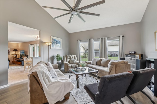9322 Via Segovia, New Port Richey, FL 34655 - living room featuring light wood finished floors, a ceiling fan, and high vaulted ceiling