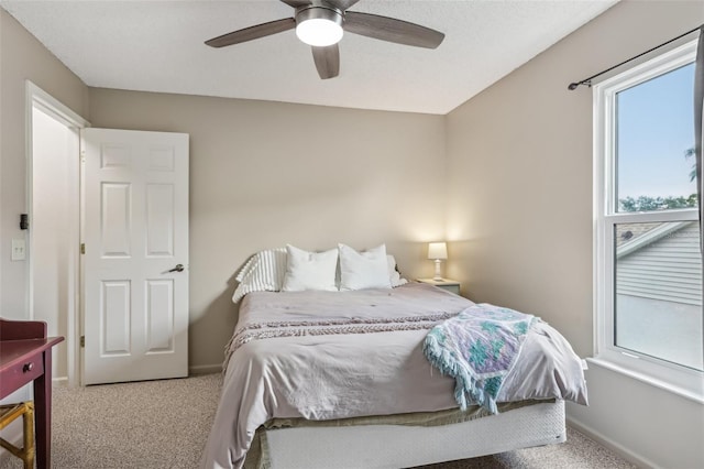 9322 Via Segovia, New Port Richey, FL 34655 - carpeted bedroom with baseboards and a ceiling fan