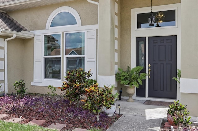 9322 Via Segovia, New Port Richey, FL 34655 - view of exterior entry with stucco siding
