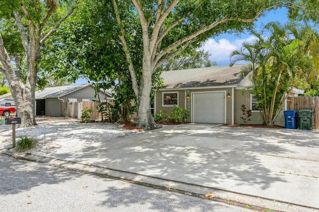 4021 Vana Dr, Sarasota, FL 34241 - view of front of house with an attached garage, driveway, and a shingled roof