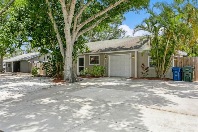 4021 Vana Dr, Sarasota, FL 34241 - ranch-style house featuring a garage, concrete driveway, and a shingled roof
