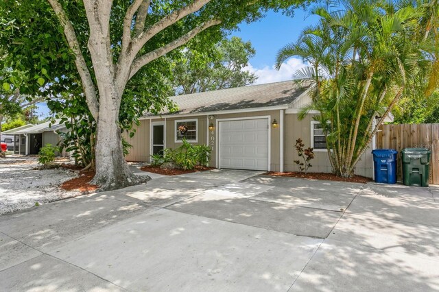 4021 Vana Dr, Sarasota, FL 34241 - view of front of property with an attached garage, driveway, and roof with shingles
