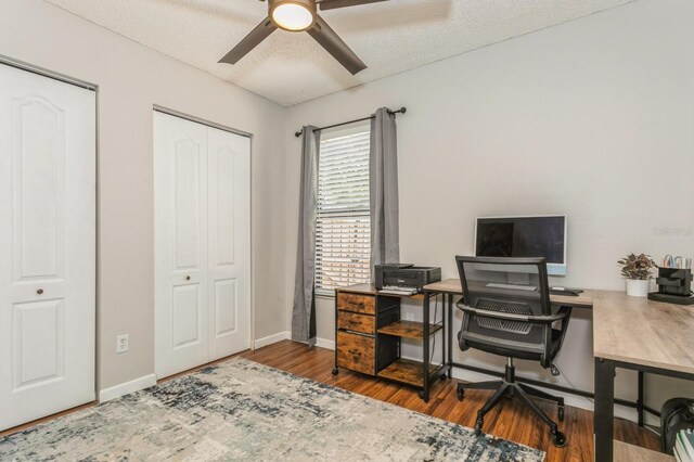 4021 Vana Dr, Sarasota, FL 34241 - office area featuring a ceiling fan, wood finished floors, baseboards, and a textured ceiling
