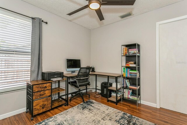 4021 Vana Dr, Sarasota, FL 34241 - home office with wood finished floors, a ceiling fan, a textured ceiling, and baseboards