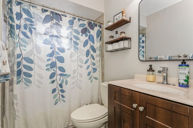 4021 Vana Dr, Sarasota, FL 34241 - bathroom with toilet, vanity, and curtained shower