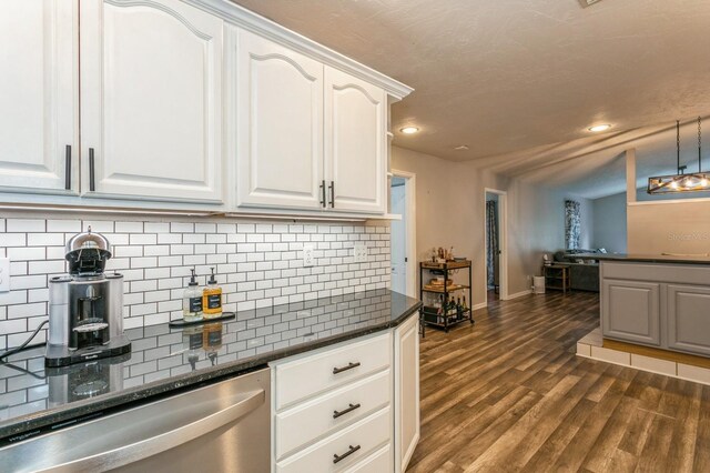 4021 Vana Dr, Sarasota, FL 34241 - kitchen with stainless steel dishwasher, recessed lighting, dark wood-style flooring, baseboards, and white cabinetry
