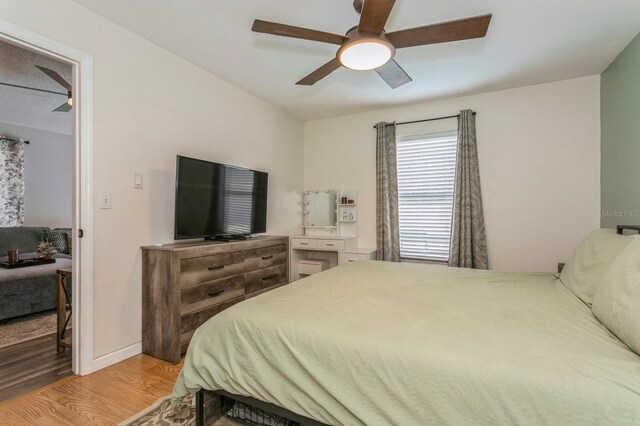 4021 Vana Dr, Sarasota, FL 34241 - bedroom featuring light wood-type flooring, a ceiling fan, and baseboards