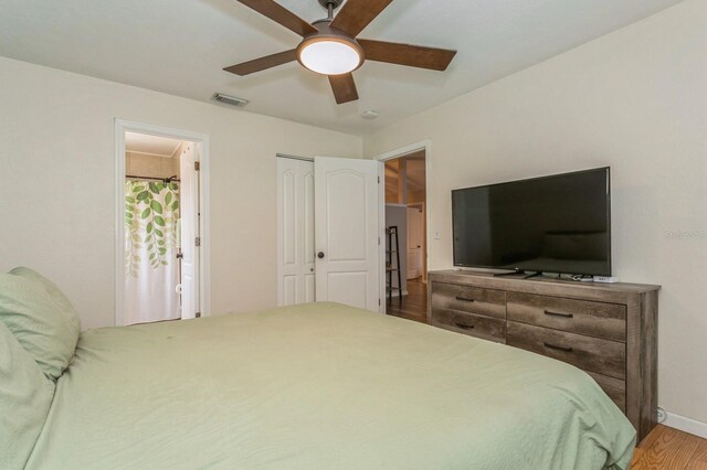 4021 Vana Dr, Sarasota, FL 34241 - bedroom with wood finished floors, baseboards, a ceiling fan, and a closet