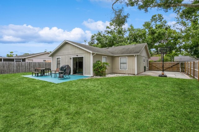 4021 Vana Dr, Sarasota, FL 34241 - rear view of house with a patio and a shingled roof