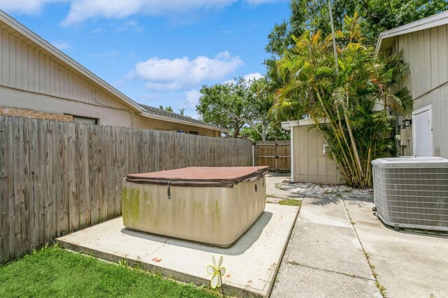 4021 Vana Dr, Sarasota, FL 34241 - fenced backyard featuring a hot tub, cooling unit, and a patio area