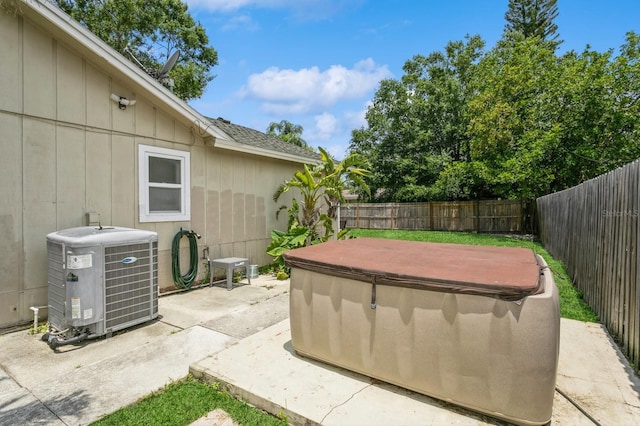 4021 Vana Dr, Sarasota, FL 34241 - fenced backyard with a hot tub, central AC unit, and a patio area