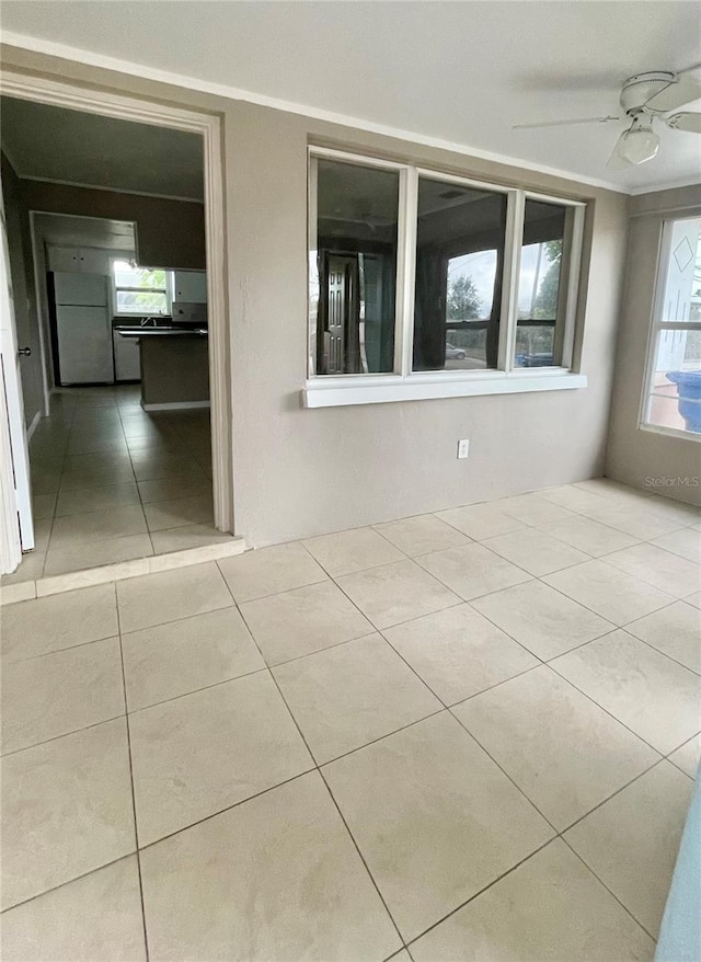 72 Lake Shore Dr, Palm Harbor, FL 34684 - spare room with tile patterned flooring and ceiling fan