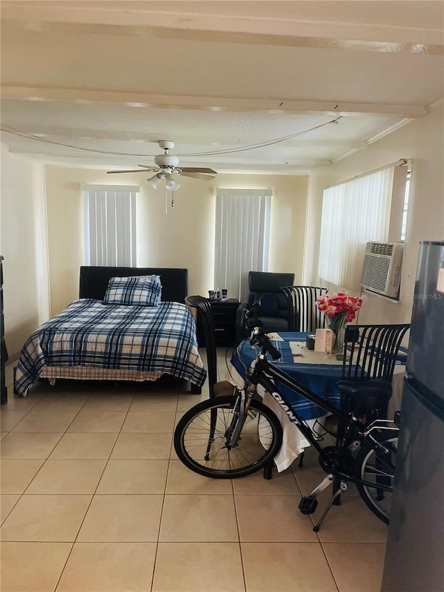 72 Lake Shore Dr, Palm Harbor, FL 34684 - bedroom with freestanding refrigerator, light tile patterned flooring, and ceiling fan