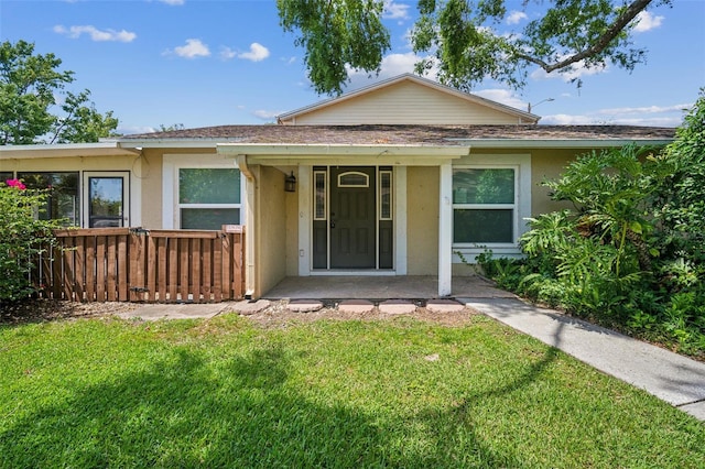 15202 Morning Dr, Lutz, FL 33559 - view of front of property with stucco siding and a front lawn