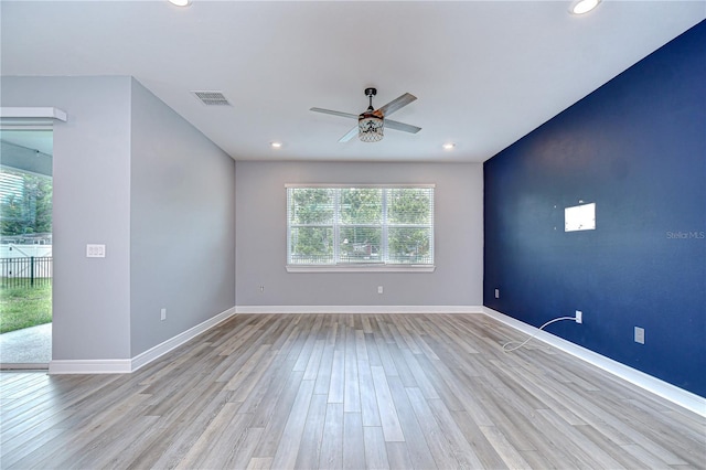 6119 Bradford Woods Dr, Zephyrhills, FL 33542 - spare room featuring ceiling fan, recessed lighting, wood finished floors, and baseboards