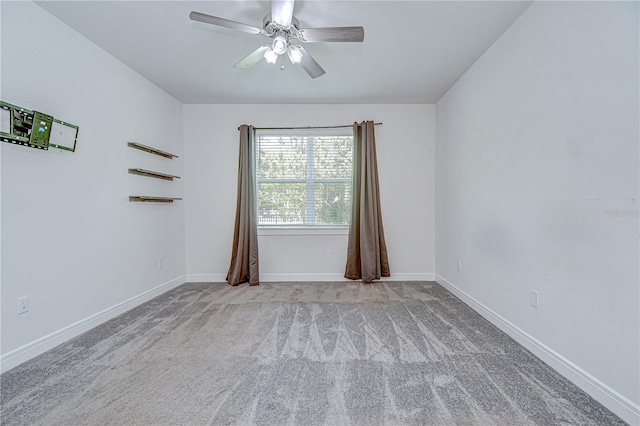 6119 Bradford Woods Dr, Zephyrhills, FL 33542 - spare room with a ceiling fan, carpet floors, and baseboards