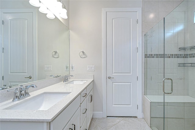 6119 Bradford Woods Dr, Zephyrhills, FL 33542 - full bathroom with double vanity, a stall shower, tile patterned flooring, a chandelier, and baseboards