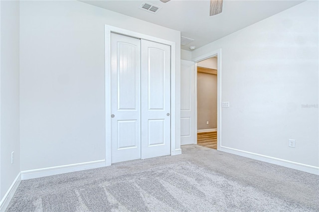 6119 Bradford Woods Dr, Zephyrhills, FL 33542 - unfurnished bedroom featuring a closet, carpet floors, baseboards, and a ceiling fan
