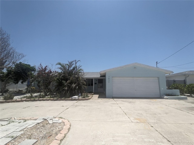 7832 3rd Ave S, Saint Petersburg, FL 33707 - single story home with driveway and a garage