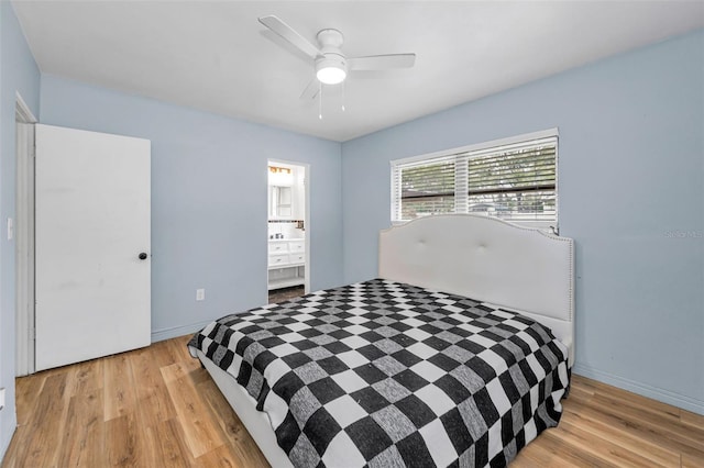 1412 Coburn Dr, Tarpon Springs, FL 34689 - bedroom featuring light wood-type flooring, baseboards, and a ceiling fan