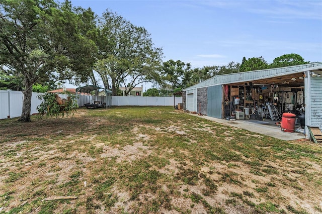 1412 Coburn Dr, Tarpon Springs, FL 34689 - view of yard featuring an outbuilding, a pole building, and a detached garage