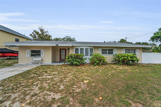 1412 Coburn Dr, Tarpon Springs, FL 34689 - ranch-style house featuring stucco siding