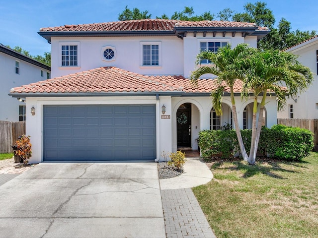 3003 W Leila Ave, Tampa, FL 33611 - mediterranean / spanish-style home featuring a tiled roof, driveway, stucco siding, and a porch