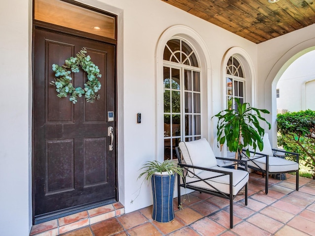3003 W Leila Ave, Tampa, FL 33611 - doorway to property with a porch and stucco siding