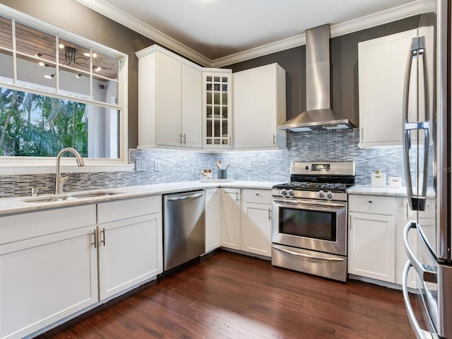 3003 W Leila Ave, Tampa, FL 33611 - kitchen with stainless steel appliances, wall chimney exhaust hood, a sink, crown molding, and backsplash