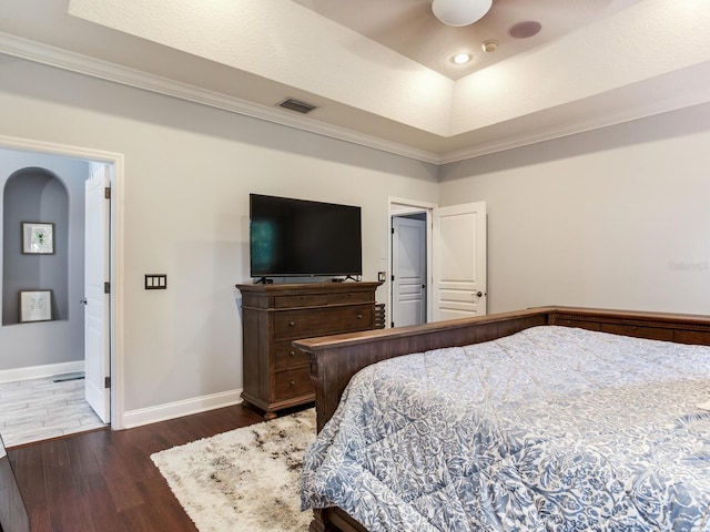 3003 W Leila Ave, Tampa, FL 33611 - bedroom featuring dark wood-style flooring, baseboards, crown molding, and a raised ceiling
