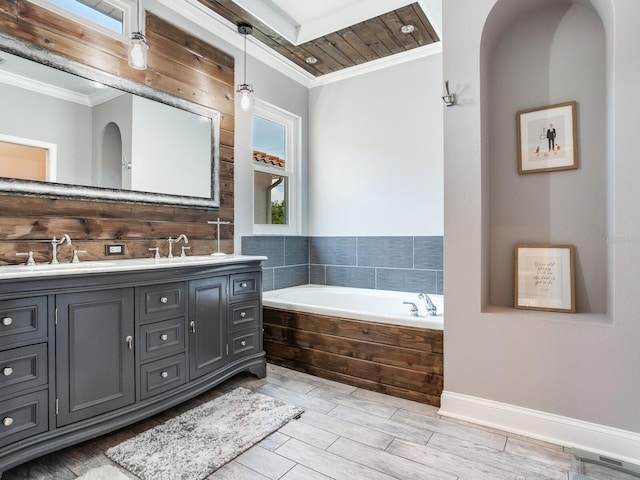 3003 W Leila Ave, Tampa, FL 33611 - full bathroom with ornamental molding, double vanity, a garden tub, and wood finish floors