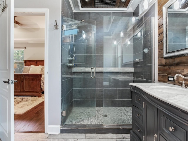 3003 W Leila Ave, Tampa, FL 33611 - ensuite bathroom with vanity, a stall shower, ornamental molding, and wood finished floors