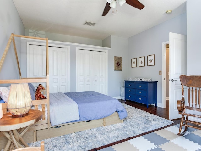 3003 W Leila Ave, Tampa, FL 33611 - bedroom with multiple closets, wood finished floors, baseboards, and a ceiling fan