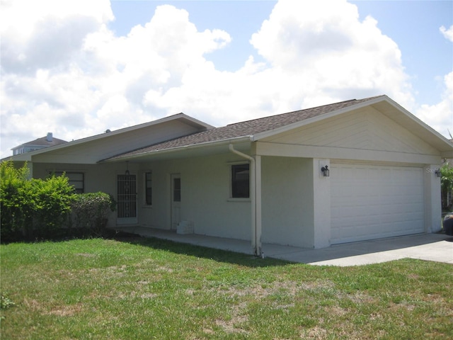 4673 Dewey Dr, New Port Richey, FL 34652 - view of property exterior featuring an attached garage, stucco siding, a yard, concrete driveway, and roof with shingles