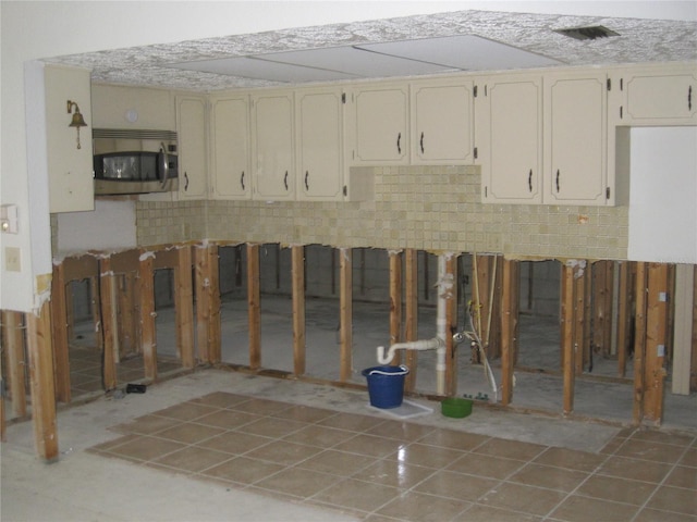 4673 Dewey Dr, New Port Richey, FL 34652 - basement featuring light tile patterned floors