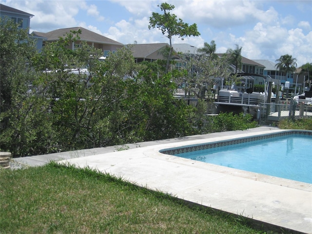 4673 Dewey Dr, New Port Richey, FL 34652 - swimming pool featuring a residential view