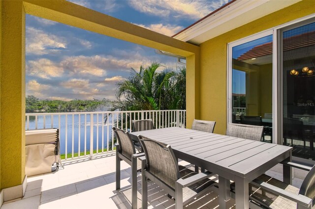 17 Franklin Ct S Unit C, Saint Petersburg, FL 33711 - balcony at dusk featuring a water view