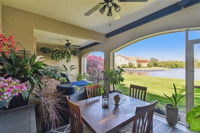 17 Franklin Ct S Unit C, Saint Petersburg, FL 33711 - view of patio featuring ceiling fan, a water view, and outdoor dining space