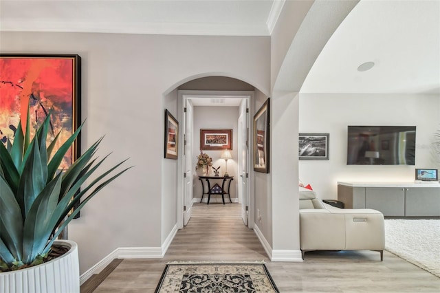 17 Franklin Ct S Unit C, Saint Petersburg, FL 33711 - hallway with arched walkways, wood finished floors, baseboards, and crown molding