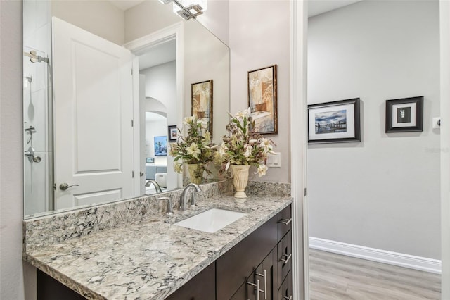 17 Franklin Ct S Unit C, Saint Petersburg, FL 33711 - bathroom with vanity, wood finished floors, and baseboards