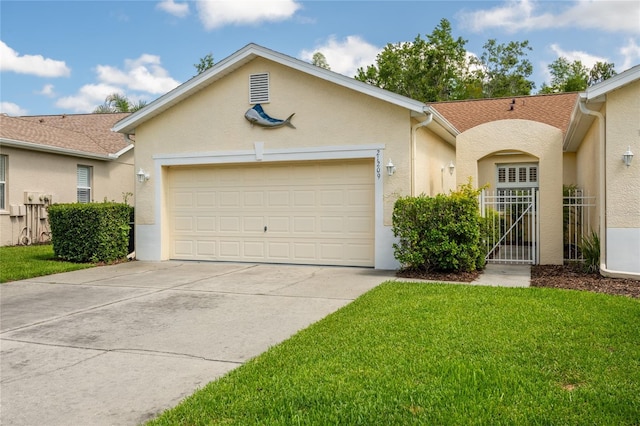 21209 Diamonte Dr, Land O Lakes, FL 34637 - view of front of house featuring stucco siding, a garage, driveway, and a front yard