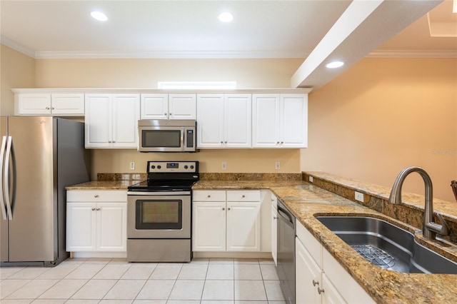 21209 Diamonte Dr, Land O Lakes, FL 34637 - kitchen with stainless steel appliances, a sink, ornamental molding, white cabinets, and recessed lighting