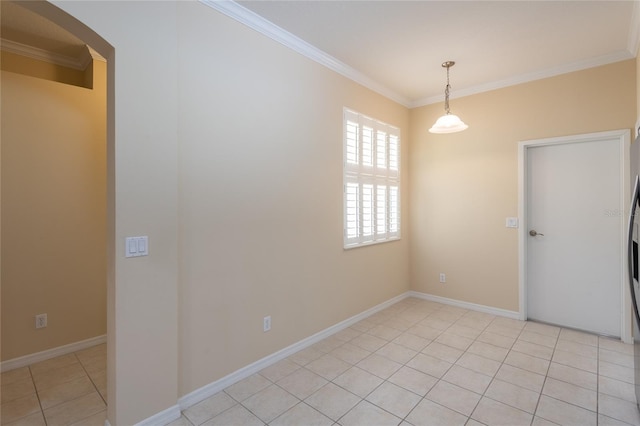 21209 Diamonte Dr, Land O Lakes, FL 34637 - unfurnished room featuring ornamental molding, light tile patterned floors, arched walkways, and baseboards