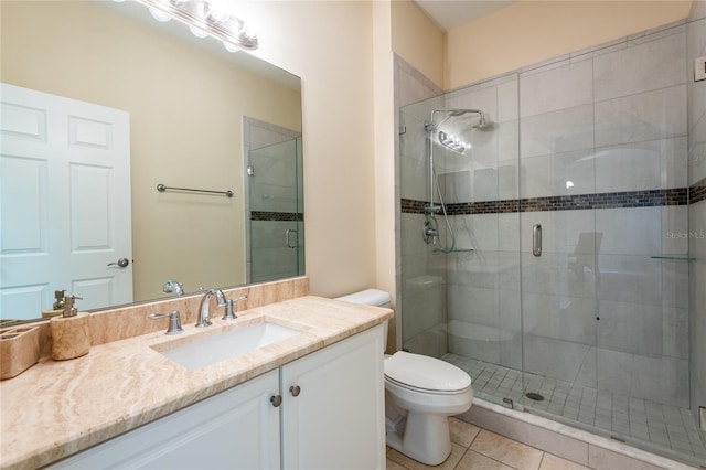 21209 Diamonte Dr, Land O Lakes, FL 34637 - bathroom with toilet, a stall shower, vanity, and tile patterned floors
